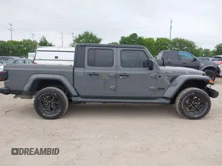 2022 Jeep Gladiator Willys with VIN 1C6JJTAMXNL137237, listed as a IAAI auction lot 41947651 with 55,199 mi miles and . Bid and sale history available at DreamBid. Image 13.