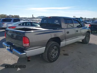 2001 Dodge Dakota Sport with VIN 1B7HL2AN21S319390, listed as a IAAI auction lot 40836729 with 118,823 mi miles. Bid and sale history available at carsss.com. Image 4.