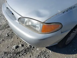 1997 Ford Escort LX with VIN 1FALP13PXVW263906, listed as a IAAI auction lot 41496083 with 1 mi miles. Bid and sale history available at carsss.com. Image 12.