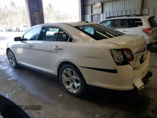 2012 Ford Taurus SEL z VIN 1FAHP2HW8CG133657, wystawiony jako Copart lot #52865895 z przebiegiem 132 876 mil mil oraz Szkoda całkowita • Salvage title. Historia ofert i sprzedaży dostępna na DreamBid. Obrazek 2.