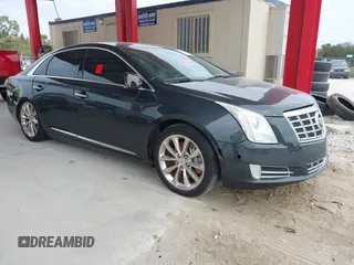 2014 Cadillac XTS Luxury with VIN 2G61M5S33E9217619, listed as a IAAI auction lot 41343003 with 126,303 mi miles. Bid and sale history available at carsss.com. Image 1.
