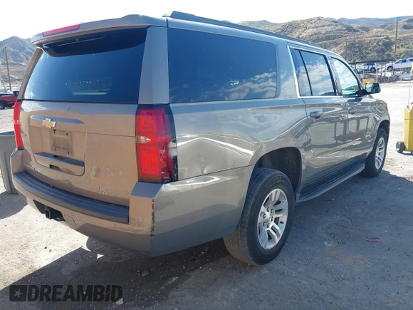 2017 Chevrolet Suburban LS with VIN 1GNSCGEC9HR355405, listed as a IAAI auction lot 41674594 with 170,312 mi miles and . Bid and sale history available at DreamBid. Image 4.