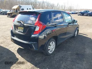 2015 Honda Fit LX z VIN 3HGGK5H51FM775176, wystawiony jako IAAI lot #41690648 z przebiegiem 49 979 mil mil oraz . Historia ofert i sprzedaży dostępna na DreamBid. Obrazek 4.