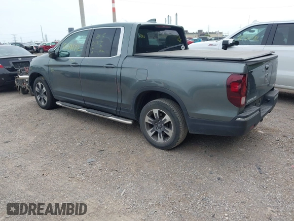 2018 Honda Ridgeline RTL-T with VIN 5FPYK3F61JB013733, listed as a IAAI auction lot 42548122 with 92,407 mi miles and . Bid and sale history available at DreamBid. Image 3.