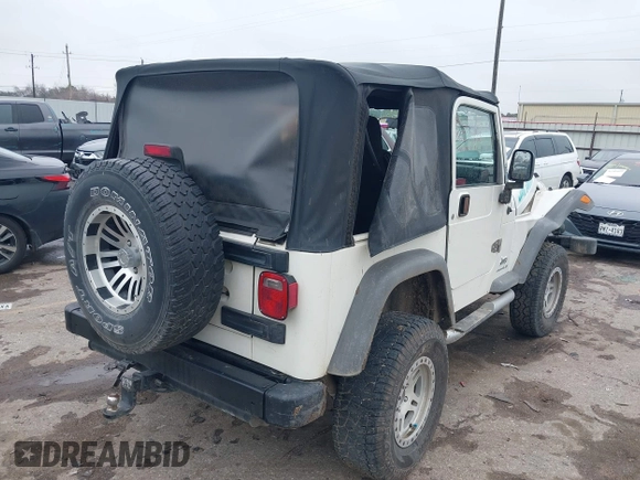 2005 Jeep Wrangler Sport with VIN 1J4FA49S25P320240, listed as a IAAI auction lot 41433371 with 144,552 mi miles. Bid and sale history available at carsss.com. Image 4.