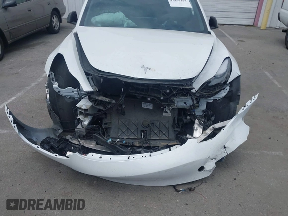 2023 Tesla Model 3 with VIN 5YJ3E1EA2PF417959, listed as a IAAI auction lot 42463853 with 22,736 mi miles and . Bid and sale history available at DreamBid. Image 6.
