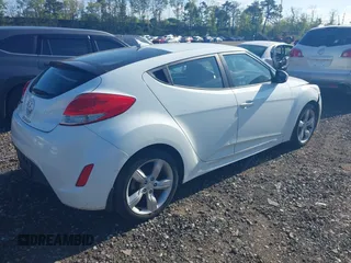 2013 Hyundai Veloster w/Gray Int with VIN KMHTC6AD2DU115735, listed as a IAAI auction lot 39404347 with 166,840 mi miles and . Bid and sale history available at DreamBid. Image 4.