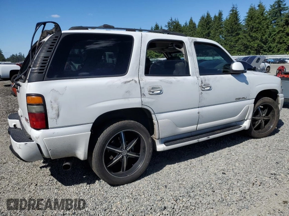 2005 GMC Yukon Denali z VIN 1GKEK63U55J143324, wystawiony jako Copart lot #59000695 z przebiegiem Nie podano mil oraz Szkoda całkowita • Salvage title. Historia ofert i sprzedaży dostępna na DreamBid. Obrazek 3.
