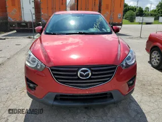 2016 Mazda CX-5 Touring with VIN JM3KE2CY0G0627886, listed as a Copart auction lot 55207054 with 95,884 mi miles and Salvage Title. Bid and sale history available at carsss.com. Image 5.
