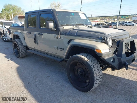 2020 Jeep Gladiator Sport S with VIN 1C6HJTAG3LL214469, listed as a IAAI auction lot 42017170 with 114,599 mi miles. Bid and sale history available at carsss.com. Image 1.