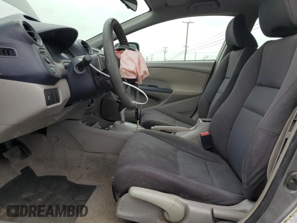 2010 Honda Insight EX with VIN JHMZE2H79AS017647, listed as a Copart auction lot 53311325 with 94,999 mi miles and Salvage Title. Bid and sale history available at DreamBid. Image 7.