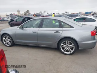 2015 Audi A6 Premium Plus z VIN WAUGFAFC6FN009203, wystawiony jako IAAI lot #42242726 z przebiegiem 69 163 mil mil oraz . Historia ofert i sprzedaży dostępna na DreamBid. Obrazek 14.