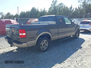 2005 Ford F-150 XLT with VIN 1FTPX12575NA61851, listed as a IAAI auction lot 41713974 with 251,639 mi miles. Bid and sale history available at carsss.com. Image 4.
