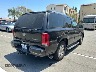 2002 Cadillac Escalade z VIN 1GYEC63T22R113253, wystawiony jako Copart lot #56408115 z przebiegiem 249 604 mil mil oraz Szkody całkowita. Historia ofert i sprzedaży dostępna na DreamBid. Obrazek 4.