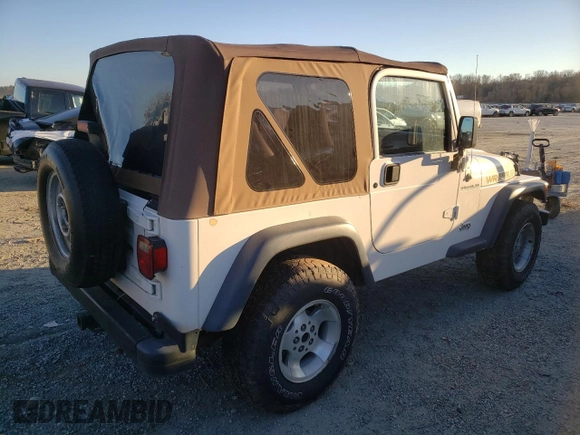 2002 Jeep Wrangler SE with VIN 1J4FA29P82P756330, listed as a Copart auction lot 83659574 with 156,901 mi miles and Salvage Title. Bid and sale history available at DreamBid. Image 3.