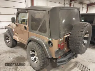 2000 Jeep Wrangler Sahara with VIN 1J4FA59S2YP740431, listed as a IAAI auction lot 41313079 with 183,989 mi miles. Bid and sale history available at carsss.com. Image 3.