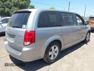 2013 Dodge Grand Caravan SE with VIN 2C4RDGBG0DR702913, listed as a IAAI auction lot 42007786 with 163,981 mi miles and . Bid and sale history available at DreamBid. Image 4.