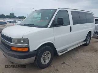 2013 Chevrolet Express Passenger 1LT with VIN 1GAZGYFG0D1117737, listed as a IAAI auction lot 42320524 with 103,968 mi miles and . Bid and sale history available at DreamBid. Image 2.