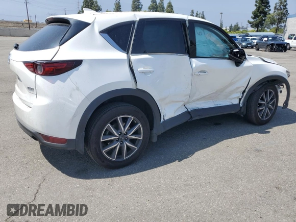 2018 Mazda CX-5 Grand Touring z VIN JM3KFADM3J1464073, wystawiony jako Copart lot #59571385 z przebiegiem Nie podano mil oraz Szkoda całkowita • Salvage title. Historia ofert i sprzedaży dostępna na DreamBid. Obrazek 3.