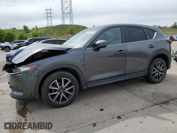 2018 Mazda CX-5 Touring z VIN JM3KFBCM2J0379190, wystawiony jako Copart lot #59233075 z przebiegiem 51 985 mil mil oraz Szkoda całkowita • Salvage title. Historia ofert i sprzedaży dostępna na DreamBid. Obrazek 1.