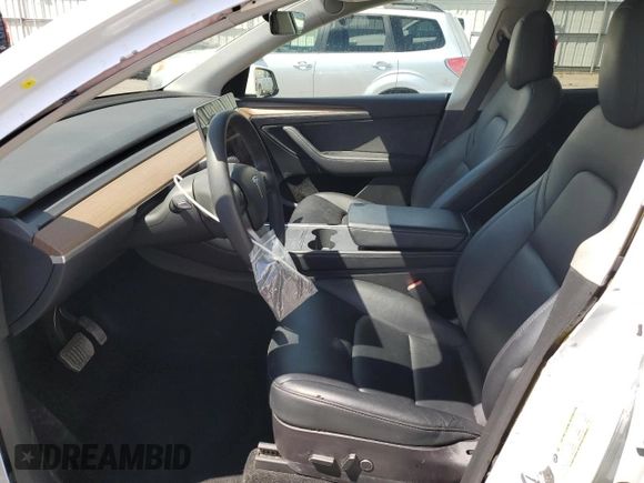 2022 Tesla Model Y Long Range with VIN 7SAYGAEE4NF534588, listed as a Copart auction lot 53274995 with 20,768 mi miles and Salvage Title. Bid and sale history available at DreamBid. Image 7.