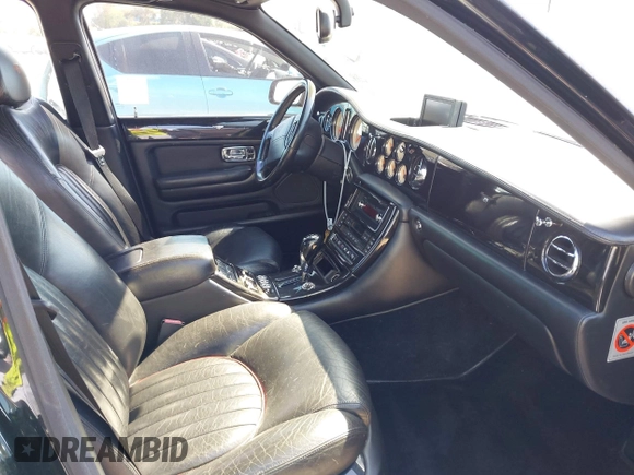 2001 Bentley Arnage with VIN SCBLC31E11CX06297, listed as a IAAI auction lot 41980275 with 63,510 mi miles and . Bid and sale history available at DreamBid. Image 5.