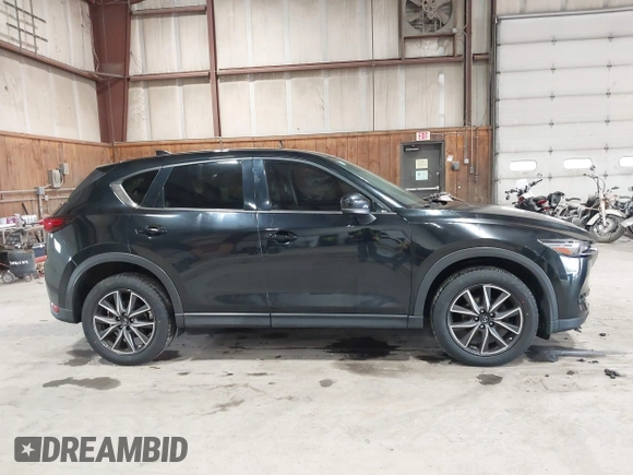 2017 Mazda CX-5 Grand Touring with VIN JM3KFBDL6H0143013, listed as a IAAI auction lot 41912979 with 122,890 mi miles. Bid and sale history available at carsss.com. Image 13.