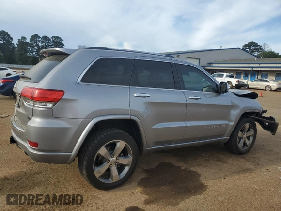 2016 Jeep Grand Cherokee Overland with VIN 1C4RJFCT2GC320247, listed as a Copart auction lot 50832195 with 104,300 mi miles and Salvage title. Bid and sale history available at DreamBid. Image 3.