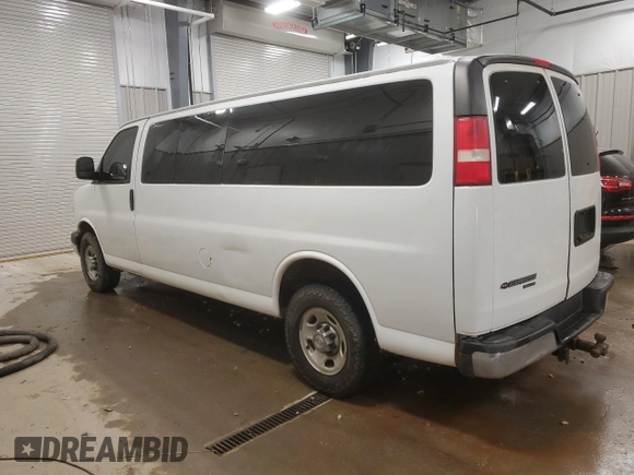 2014 Chevrolet Express Passenger LT with VIN 1GAZG1FG4E1176590, listed as a Copart auction lot 83660024 with 167,653 mi miles and Salvage title. Bid and sale history available at DreamBid. Image 2.