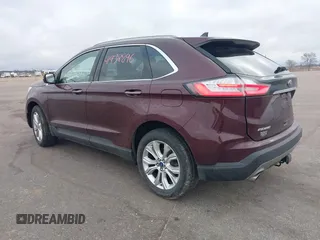 2020 Ford Edge Titanium z VIN 2FMPK4K91LBB56297, wystawiony jako IAAI lot #41938896 z przebiegiem 79 875 mil mil oraz . Historia ofert i sprzedaży dostępna na DreamBid. Obrazek 3.