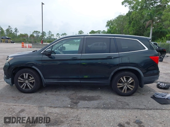 2017 Honda Pilot EX-L with VIN 5FNYF6H50HB033968, listed as a IAAI auction lot 42400720 with 119,597 mi miles and . Bid and sale history available at DreamBid. Image 14.