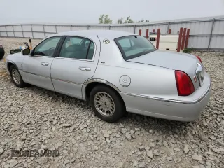 1998 Lincoln Town Car Cartier z VIN 1LNFM83W6WY649580, wystawiony jako Copart lot #59198865 z przebiegiem 253 735 mil mil oraz Czysty tytuł • Clean title. Historia ofert i sprzedaży dostępna na DreamBid. Obrazek 2.