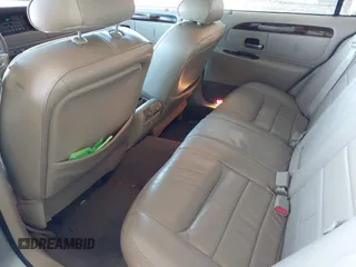 2000 Lincoln Town Car Signature z VIN 1LNHM82W1YY869805, wystawiony jako IAAI lot #42051938 z przebiegiem 125 940 mil mil oraz . Historia ofert i sprzedaży dostępna na DreamBid. Obrazek 8.