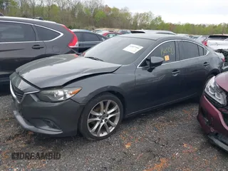 2014 Mazda 6 i Grand Touring with VIN JM1GJ1W50E1107877, listed as a IAAI auction lot 41857596 with 166,188 mi miles and . Bid and sale history available at DreamBid. Image 2.