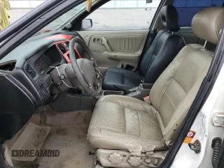1999 Infiniti G20 z VIN JNKCP11A8XT019442, wystawiony jako Copart lot #66429804 z przebiegiem 209 367 mil mil oraz Szkody całkowita. Historia ofert i sprzedaży dostępna na DreamBid. Obrazek 7.