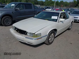 2000 Cadillac Eldorado Touring ETC z VIN 1G6ET129XYU162451, wystawiony jako IAAI lot #42412406 z przebiegiem 89 413 mil mil oraz . Historia ofert i sprzedaży dostępna na DreamBid. Obrazek 2.