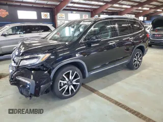 2020 Honda Pilot Touring 7-Passenger z VIN 5FNYF6H6XLB003409, wystawiony jako Copart lot #88001155 z przebiegiem Nie podano mil oraz Szkoda całkowita • Salvage title. Historia ofert i sprzedaży dostępna na DreamBid. Obrazek 1.