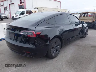 2022 Tesla Model 3 with VIN 5YJ3E1EA7NF314744, listed as a IAAI auction lot 42057596 with 30,936 mi miles and . Bid and sale history available at DreamBid. Image 4.