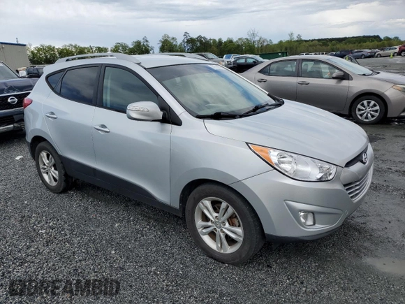 2013 Hyundai Tucson GLS with VIN KM8JU3AC1DU709937, listed as a Copart auction lot 52716295 with 181,711 mi miles and Salvage Title. Bid and sale history available at carsss.com. Image 4.