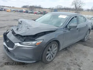 2020 Mazda 6 Grand Touring with VIN JM1GL1TY6L1525169, listed as a IAAI auction lot 41683512 with 73,313 mi miles and . Bid and sale history available at DreamBid. Image 2.