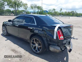 2014 Chrysler 300 C with VIN 2C3CCAKT9EH171614, listed as a IAAI auction lot 39747704 with 129,156 mi miles and . Bid and sale history available at carsss.com. Image 3.