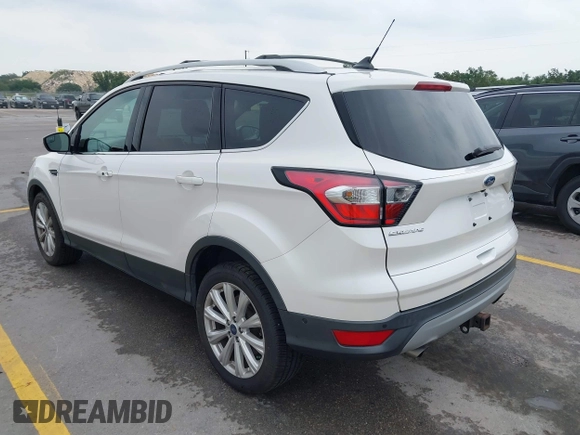 2018 Ford Escape Titanium with VIN 1FMCU9J98JUB87867, listed as a IAAI auction lot 42300123 with 48,357 mi miles and . Bid and sale history available at DreamBid. Image 3.
