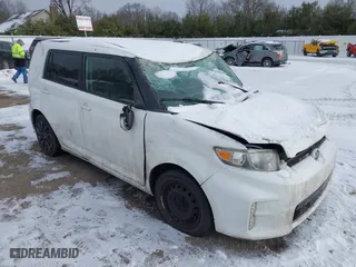 2013 Scion xB with VIN JTLZE4FE2DJ034562, listed as a IAAI auction lot 41311255 with 100,454 mi miles. Bid and sale history available at carsss.com. Image 1.