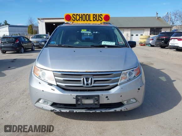 2012 Honda Odyssey Touring with VIN 5FNRL5H95CB063003, listed as a IAAI auction lot 41871975 with 179,332 mi miles and . Bid and sale history available at DreamBid. Image 12.