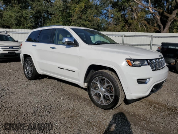 2019 Jeep Grand Cherokee Overland with VIN 1C4RJFCT2KC834690, listed as a Copart auction lot 84303144 with 63,053 mi miles and Salvage Title. Bid and sale history available at carsss.com. Image 4.