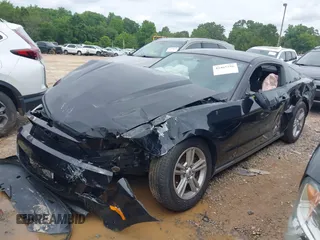 2012 Ford Mustang Premium with VIN 1ZVBP8AM4C5285696, listed as a IAAI auction lot 42465296 with 143,387 mi miles and . Bid and sale history available at DreamBid. Image 2.
