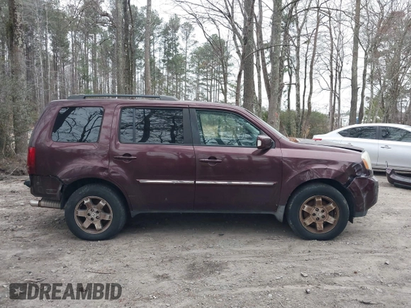 2010 Honda Pilot Touring with VIN 5FNYF4H9XAB040715, listed as a IAAI auction lot 41807334 with 262,786 mi miles and . Bid and sale history available at carsss.com. Image 14.