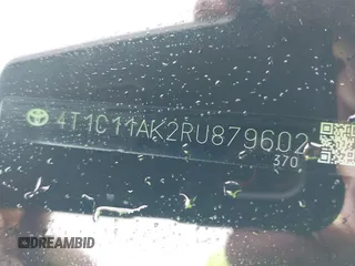 2024 Toyota Camry LE z VIN 4T1C11AK2RU879602, wystawiony jako IAAI lot #42162353 z przebiegiem 6 185 mil mil oraz . Historia ofert i sprzedaży dostępna na DreamBid. Obrazek 9.