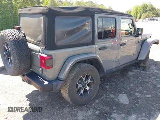 2018 Jeep Wrangler Unlimited Rubicon with VIN 1C4HJXFG6JW267087, listed as a IAAI auction lot 42235058 with 93,962 mi miles and . Bid and sale history available at DreamBid. Image 4.