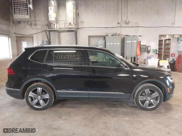 2020 Volkswagen Tiguan SE with VIN 3VV2B7AX4LM115131, listed as a IAAI auction lot 42017352 with 87,909 mi miles. Bid and sale history available at carsss.com. Image 13.